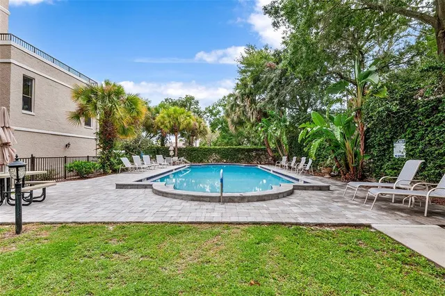 a view of a backyard with a patio