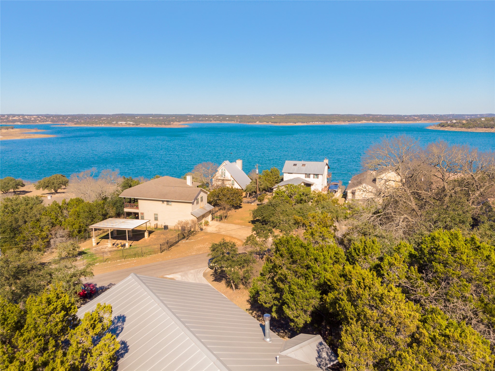 1526 Lakeside Drive West Canyon Lake, TX 78133 - Photo 1 of 35 Kick back and enjoy the most spectacular 180 degree view of Canyon Lake and the Hill Country. You’ll love the amazing deck overlooking the lake — stretching across the whole home with stunning views from sunrise to sunset!