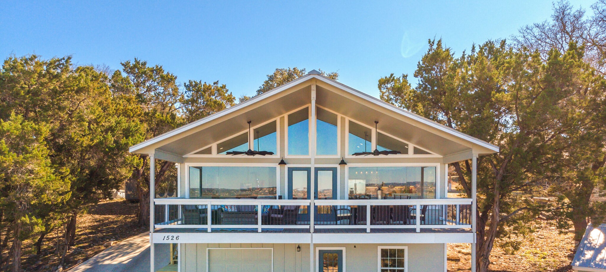 1526 Lakeside Drive West Canyon Lake, TX 78133 - Photo 2 of 35 Welcome to our lovingly renovated lake house — a true labor of love designed to feel like home the moment you arrive. Enjoy two cozy bedrooms on the main level plus a spacious guest suite downstairs! Bright, open living area with gourmet kitchen perfect for cooking and gathering.