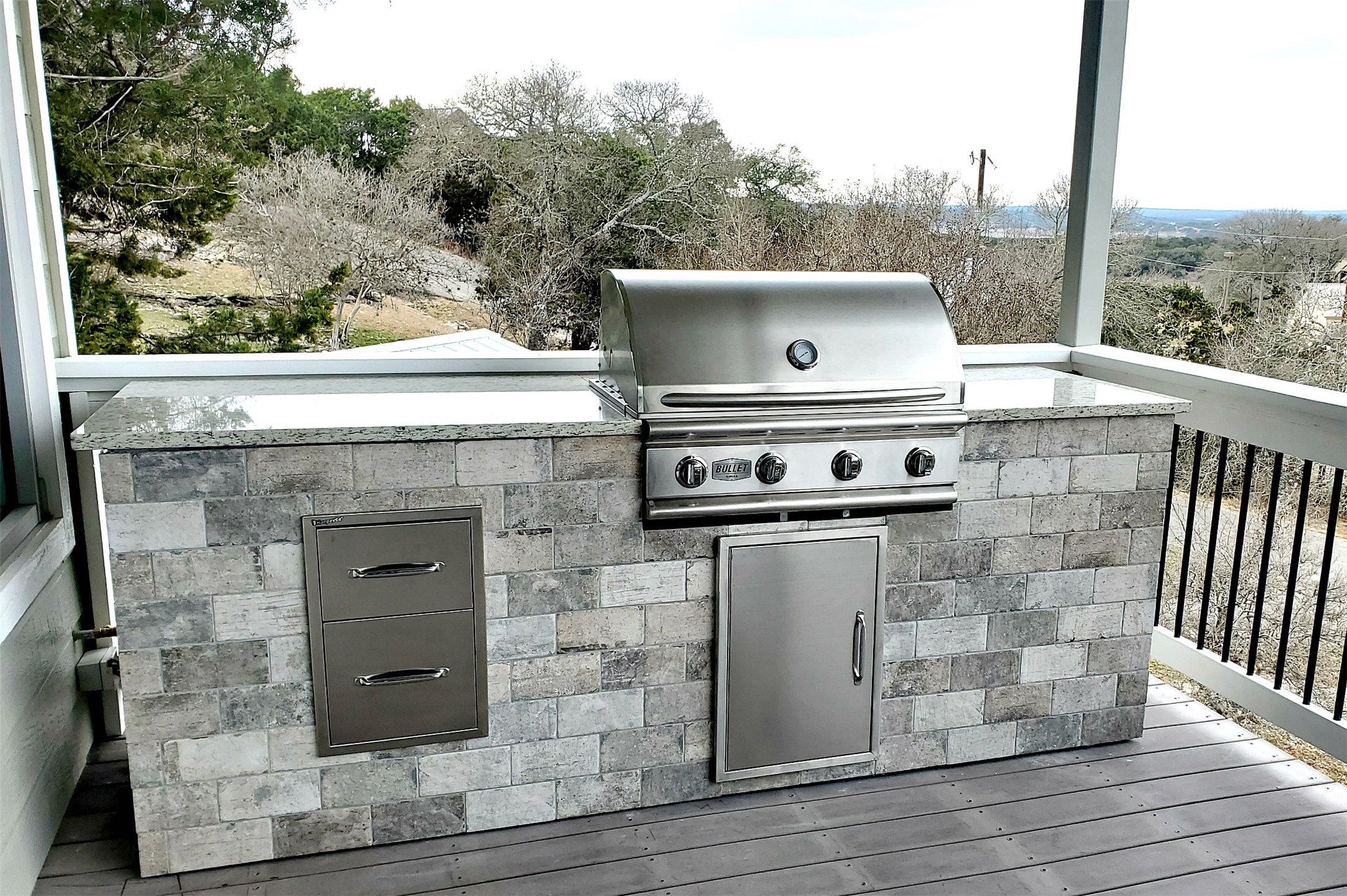 1526 Lakeside Drive West Canyon Lake, TX 78133 - Photo 23 of 35 Complete with granite counters, storage and stainless-steel Bull brand grill this outdoor kitchen adds an exceptional touch to your vacation rental. With inline propane feed there is no need to worry about having an empty tank!