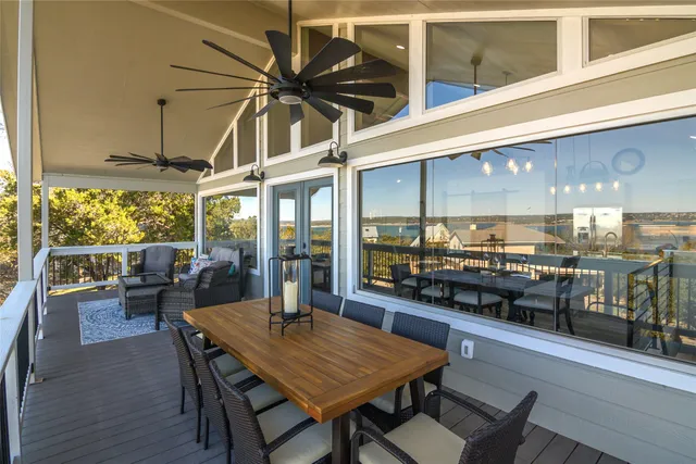 a bedroom with a bed and a flat tv screen on the dresser
