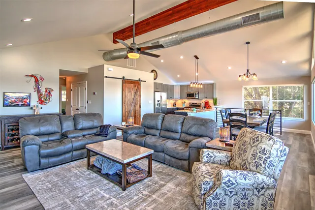 a view of a dining area with furniture and kitchen view