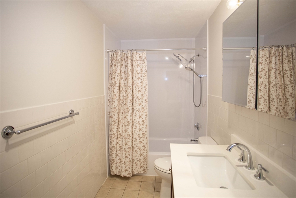 5 Washington Street, Unit C9 Reading, MA 01867 - Photo 10 of 21 a bathroom with a sink and a shower