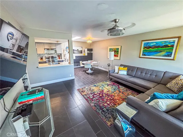 a living room with furniture and a rug