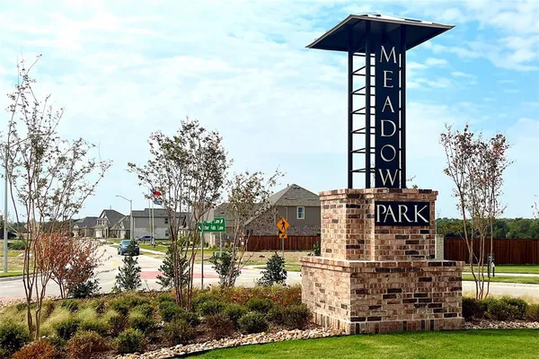 a front view of a building with garden