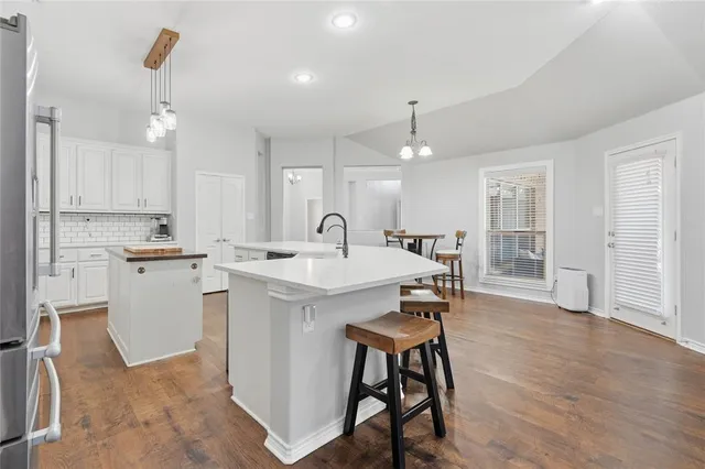 a view of a livingroom with furniture window and wooden floor