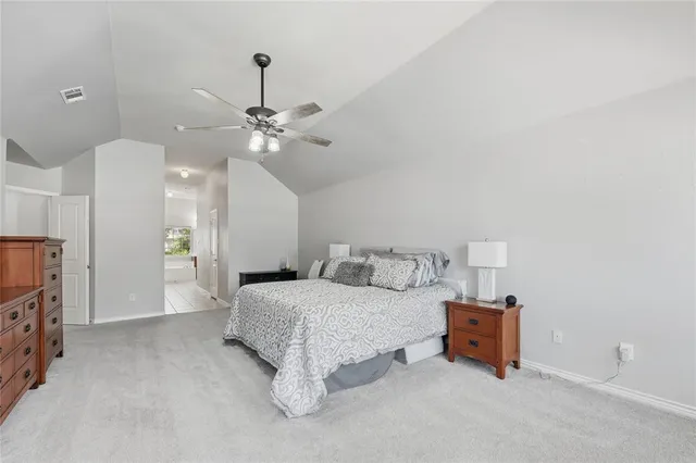 a large bathroom with a large tub sink shower and mirror