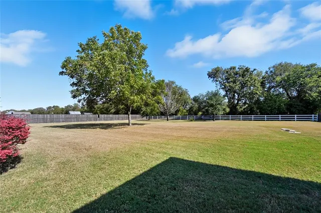 a backyard of a house with wooden floor