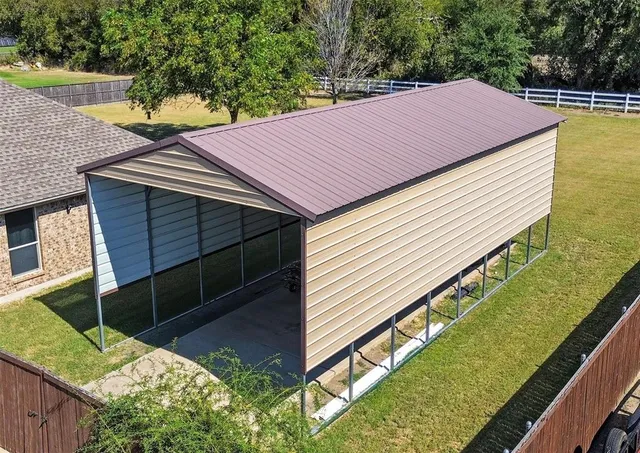 an aerial view of a house with a garden