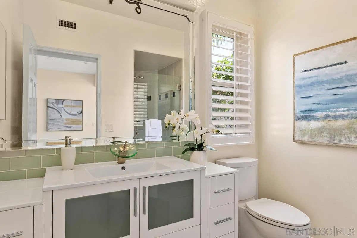 7337 Melodia Terrace Carlsbad, CA 92011 - Photo 20 of 42 a bathroom with a sink and a mirror