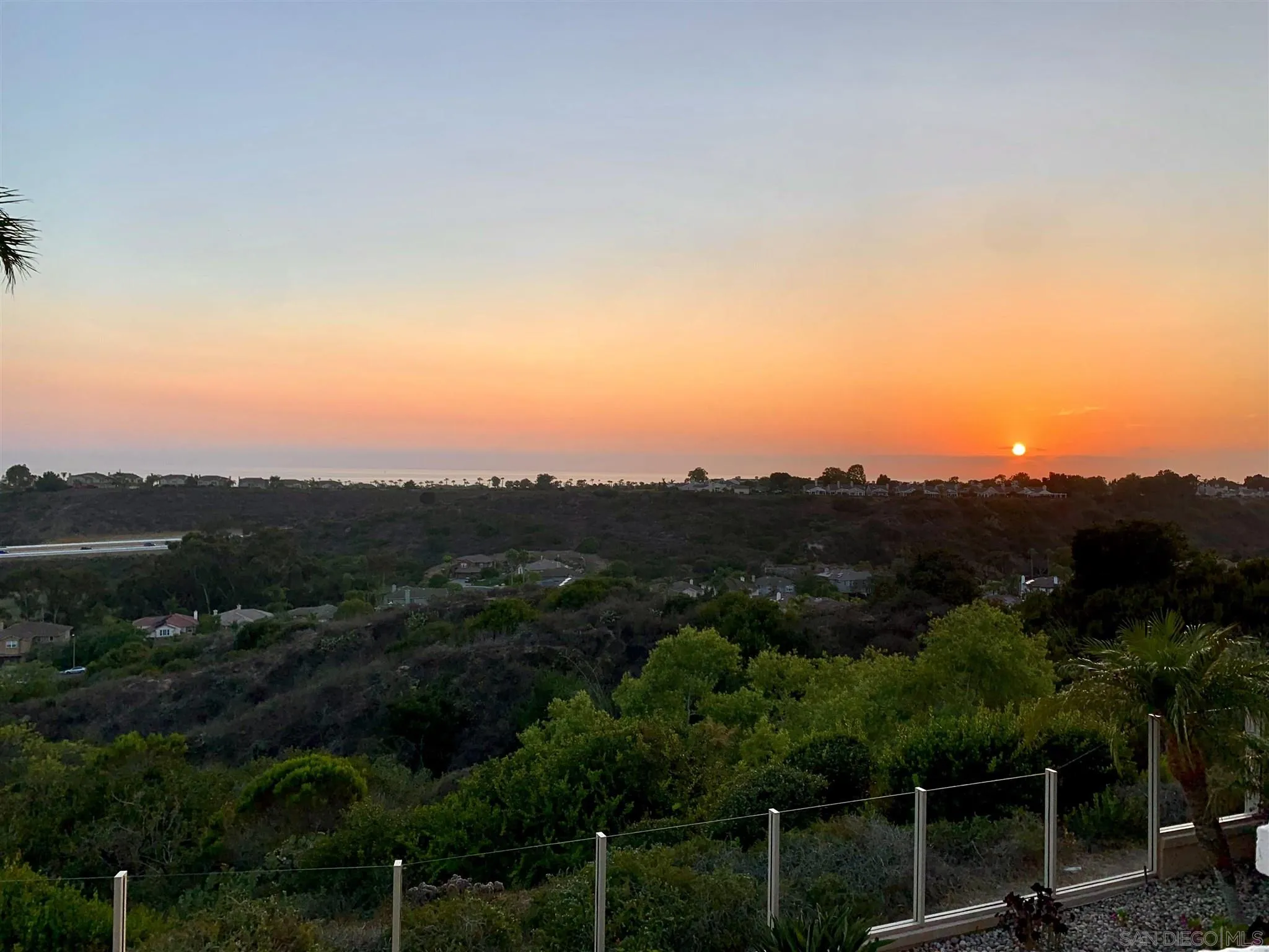 7337 Melodia Terrace Carlsbad, CA 92011 - Photo 2 of 42 a view of a city with lush green forest