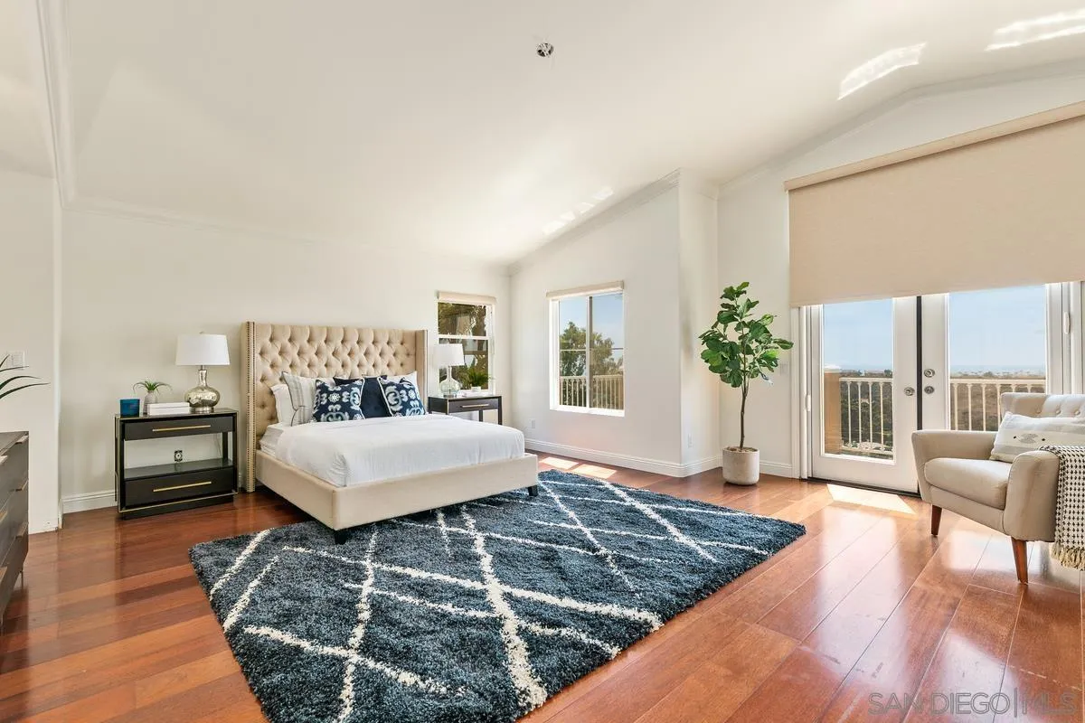 7337 Melodia Terrace Carlsbad, CA 92011 - Photo 23 of 42 a living room with furniture and a large window