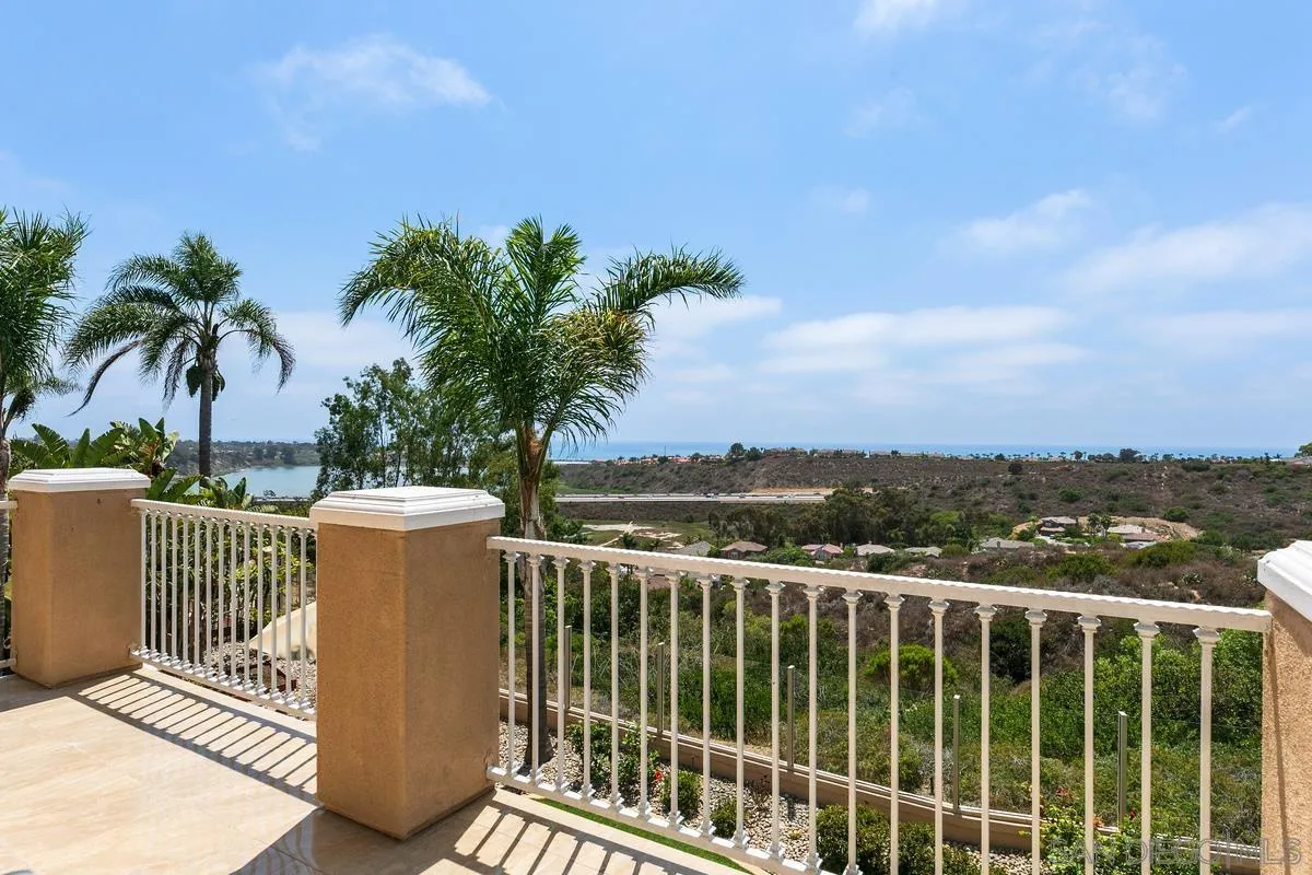 7337 Melodia Terrace Carlsbad, CA 92011 - Photo 24 of 42 a view of a balcony with lake view and wooden floor