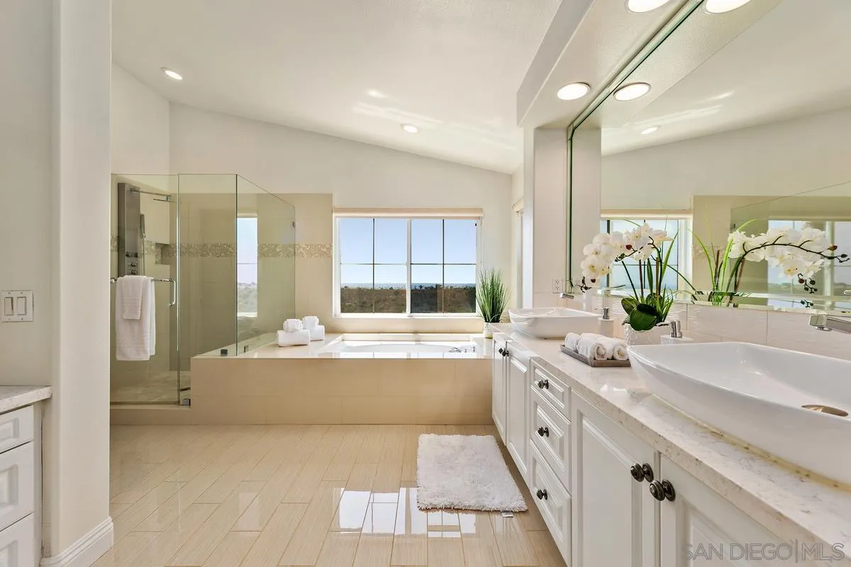 7337 Melodia Terrace Carlsbad, CA 92011 - Photo 26 of 42 a large bathroom with a large tub and sink