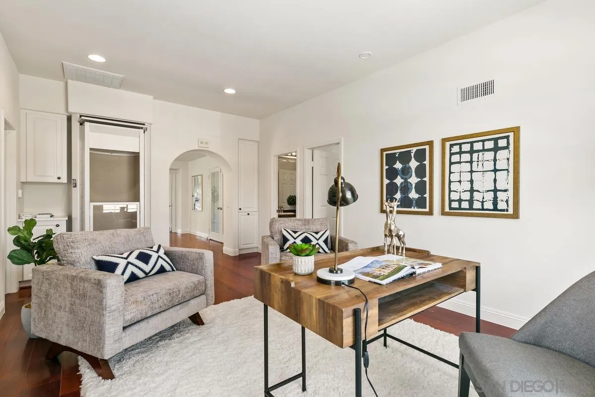 7337 Melodia Terrace Carlsbad, CA 92011 - Photo 30 of 42 a living room with furniture and wooden floor