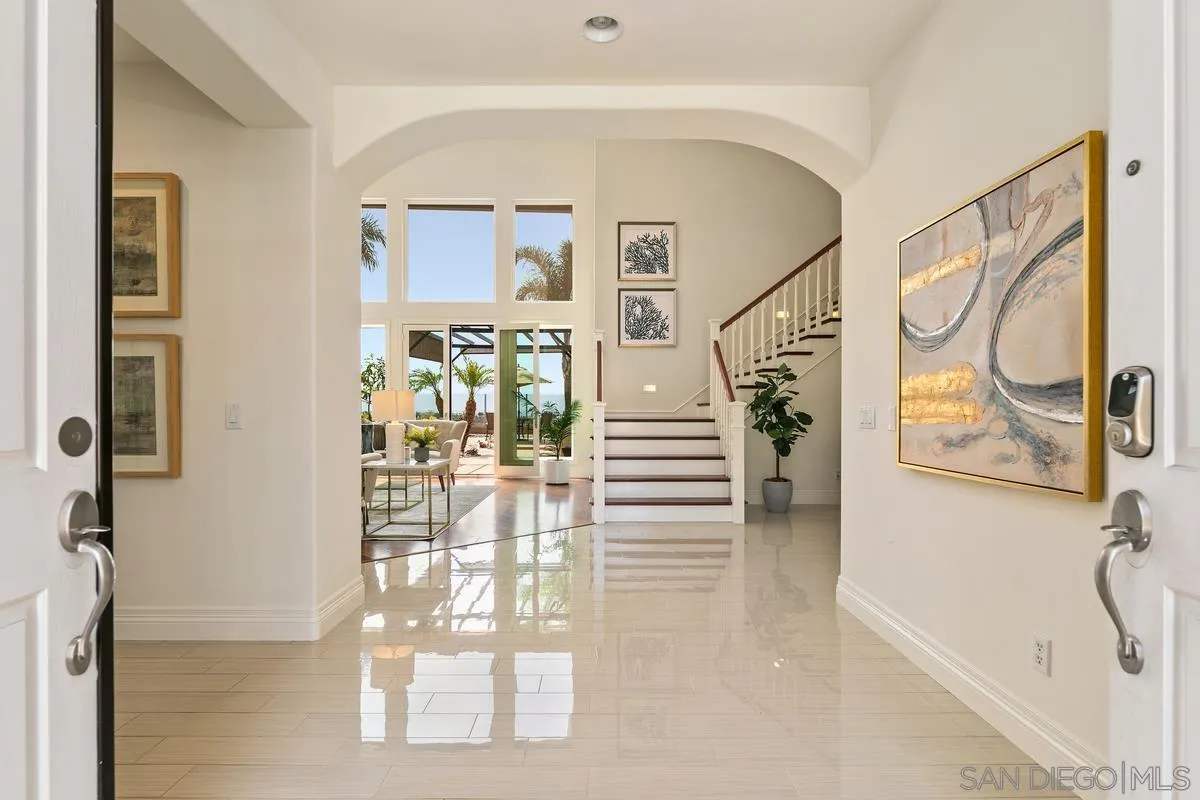 7337 Melodia Terrace Carlsbad, CA 92011 - Photo 3 of 42 a view of entryway and hall with wooden floor