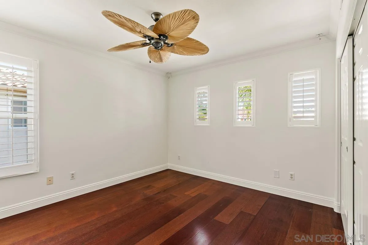 7337 Melodia Terrace Carlsbad, CA 92011 - Photo 34 of 42 wooden floor in an empty room with a window