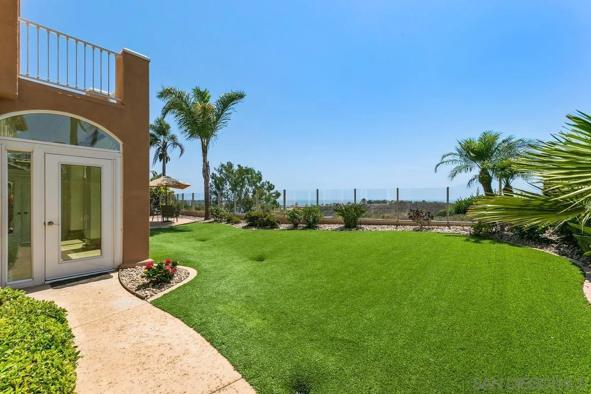 7337 Melodia Terrace Carlsbad, CA 92011 - Photo 36 of 42 a front view of a house with garden