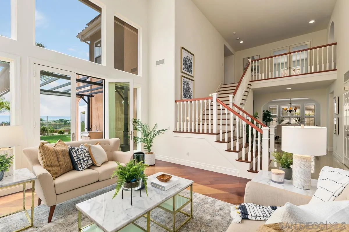 7337 Melodia Terrace Carlsbad, CA 92011 - Photo 5 of 42 a living room with furniture and a large window