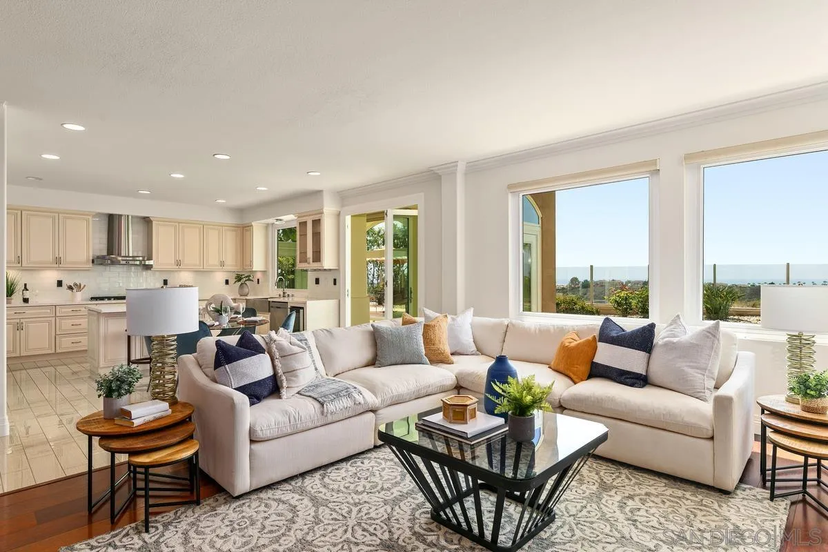 7337 Melodia Terrace Carlsbad, CA 92011 - Photo 9 of 42 a living room with furniture wooden floor and a large window