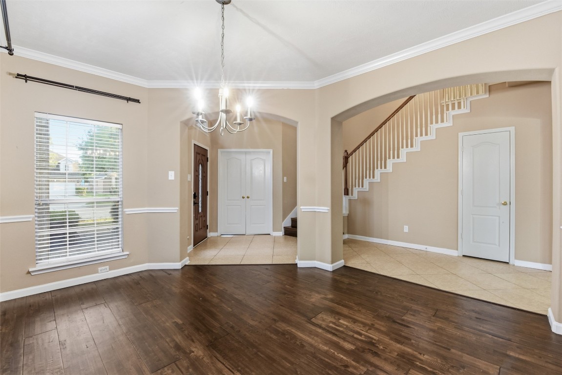 24938 Crystal Stone Lane Katy, TX 77494 - Photo 12 of 50 an empty room with wooden floor and windows