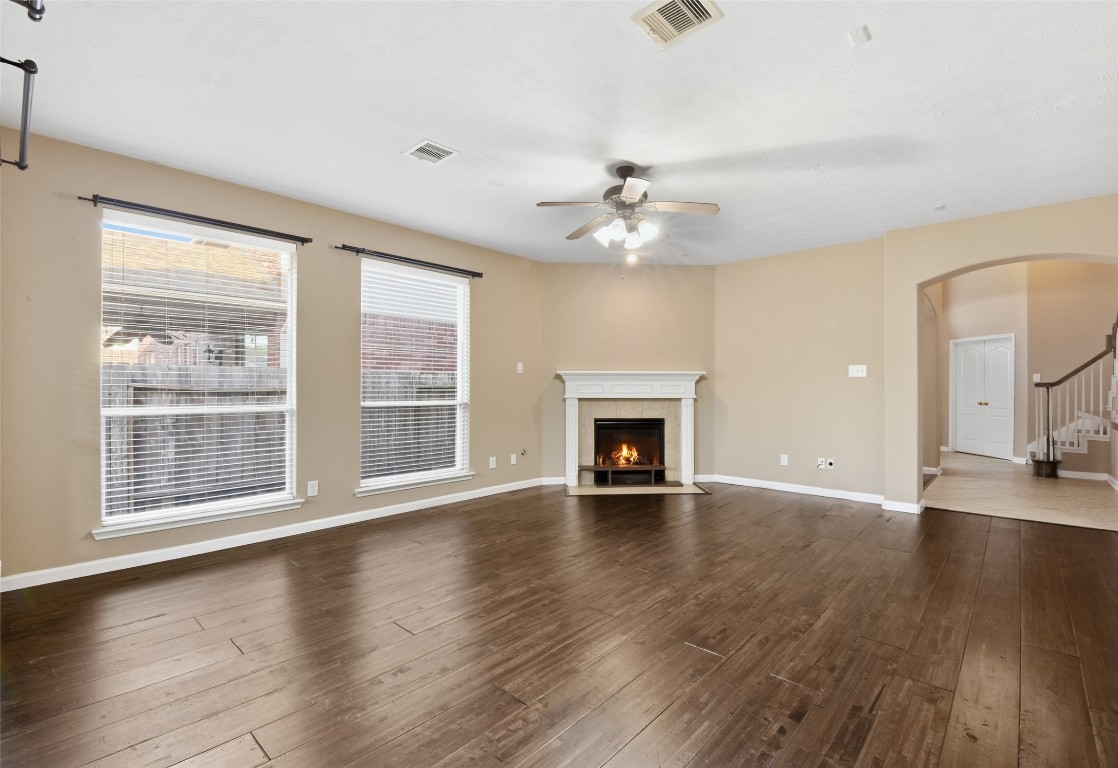 24938 Crystal Stone Lane Katy, TX 77494 - Photo 14 of 50 a view of an empty room with wooden floor and a window