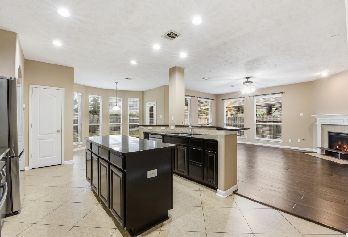 24938 Crystal Stone Lane Katy, TX 77494 - Photo 20 of 50 a kitchen with stainless steel appliances granite countertop a stove and a refrigerator