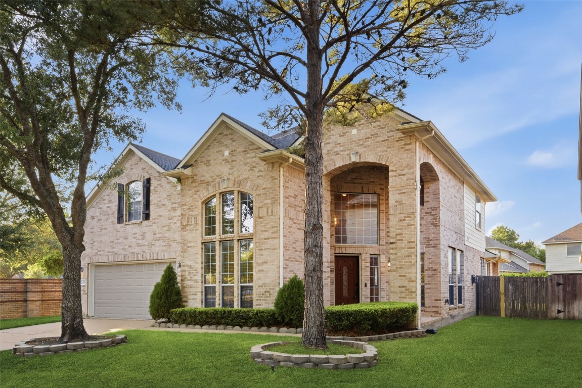 24938 Crystal Stone Lane Katy, TX 77494 - Photo 2 of 50 a front view of a house with a garden