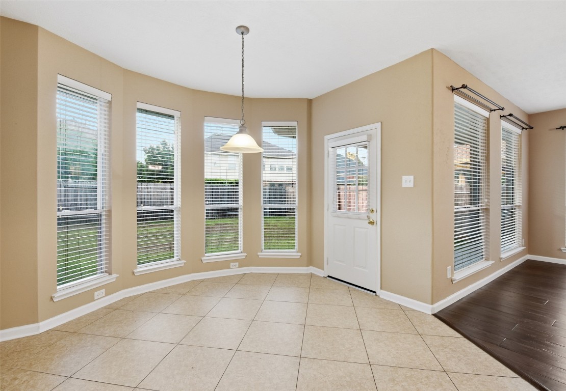 24938 Crystal Stone Lane Katy, TX 77494 - Photo 23 of 50 a view of an empty room with glass door and windows
