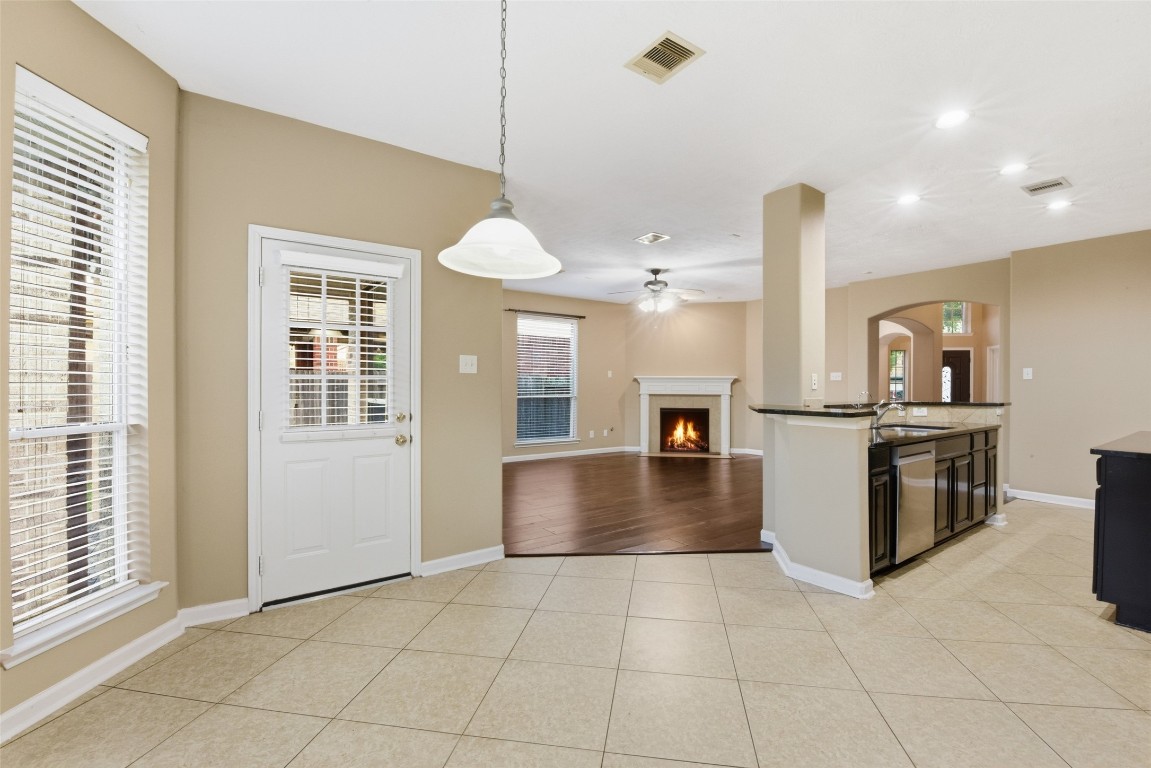 24938 Crystal Stone Lane Katy, TX 77494 - Photo 25 of 50 a kitchen with granite countertop a stove and a refrigerator
