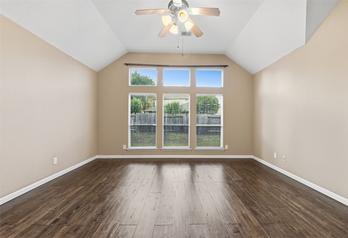 24938 Crystal Stone Lane Katy, TX 77494 - Photo 27 of 50 a view of an empty room with wooden floor and a window