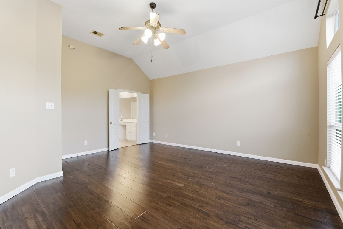 24938 Crystal Stone Lane Katy, TX 77494 - Photo 28 of 50 an empty room with wooden floor and windows