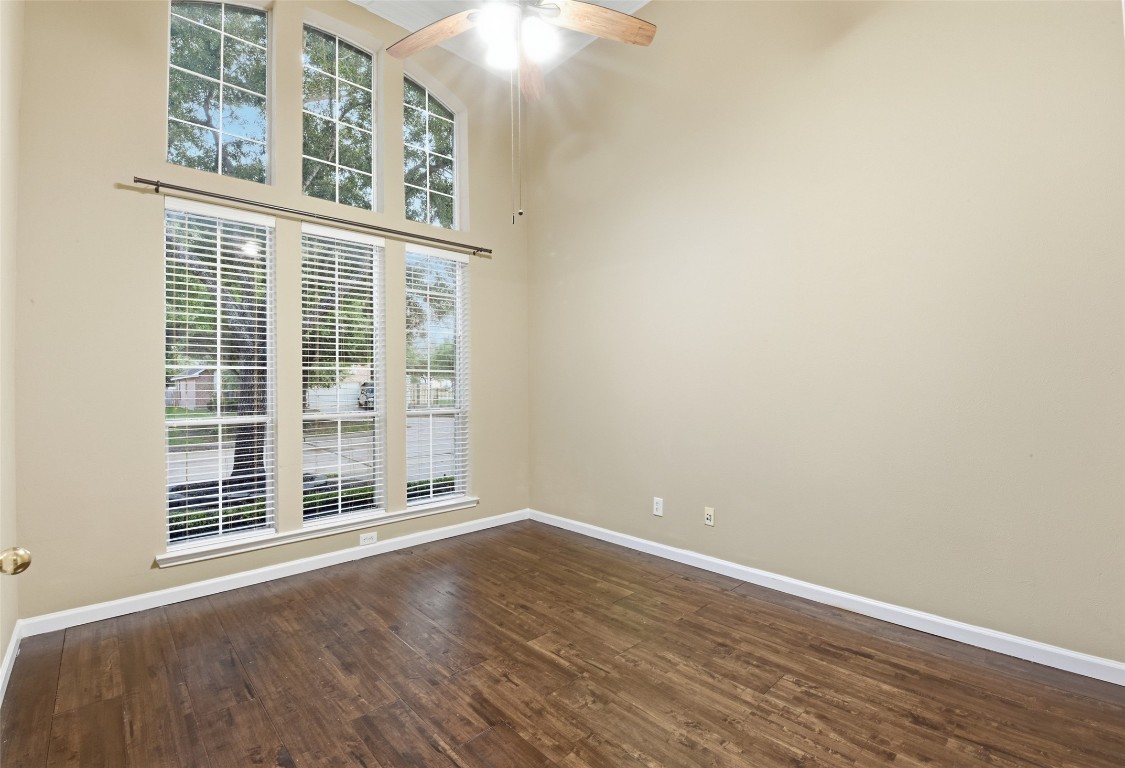 24938 Crystal Stone Lane Katy, TX 77494 - Photo 36 of 50 an empty room with wooden floor and windows