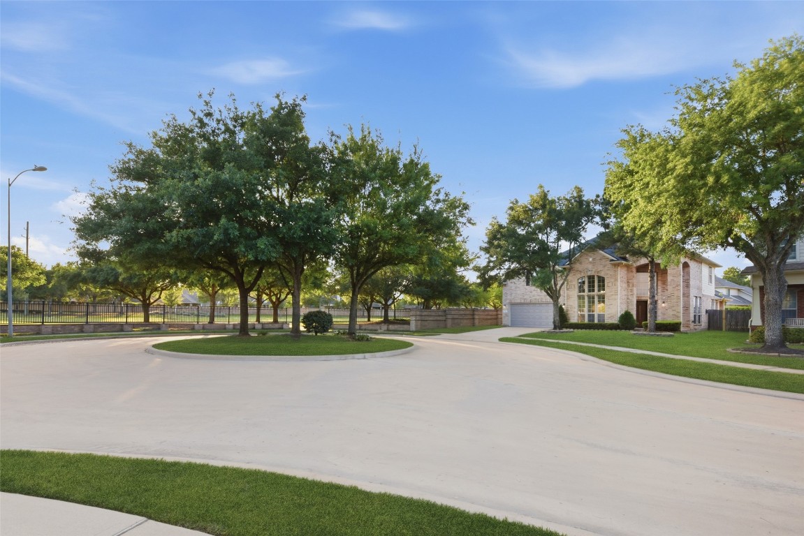 24938 Crystal Stone Lane Katy, TX 77494 - Photo 4 of 50 a view of a house with a big yard and large trees