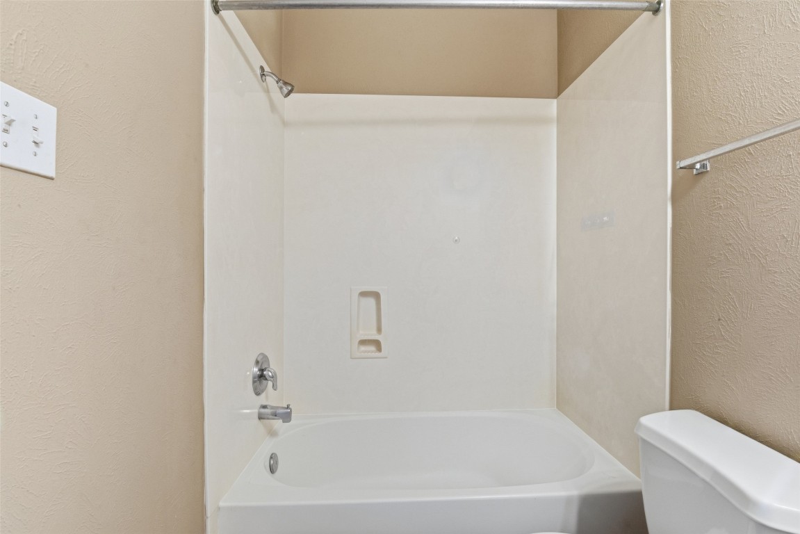 24938 Crystal Stone Lane Katy, TX 77494 - Photo 43 of 50 a white bath tub sitting next to a white toilet