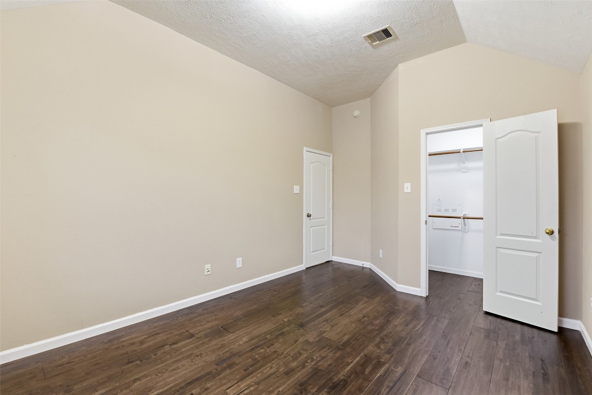 24938 Crystal Stone Lane Katy, TX 77494 - Photo 47 of 50 a view of empty room with wooden floor