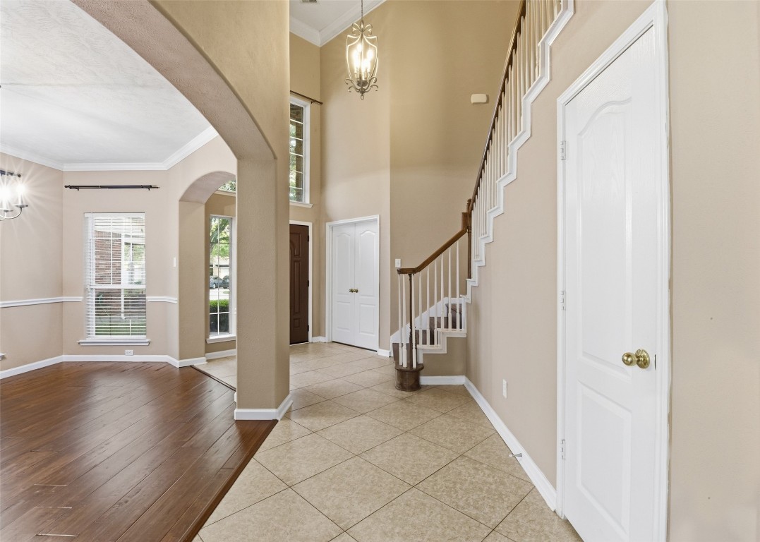 24938 Crystal Stone Lane Katy, TX 77494 - Photo 8 of 50 a view of an entryway with wooden floor and stairs