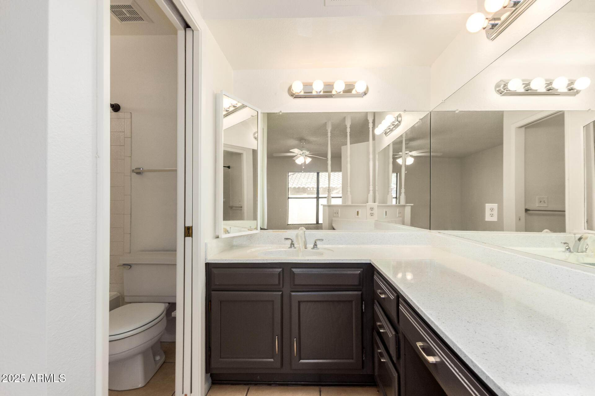 4346 East Sandia Street, Unit 5815 Phoenix, AZ 85044 - Photo 12 of 20 a bathroom with a sink double vanity and a mirror