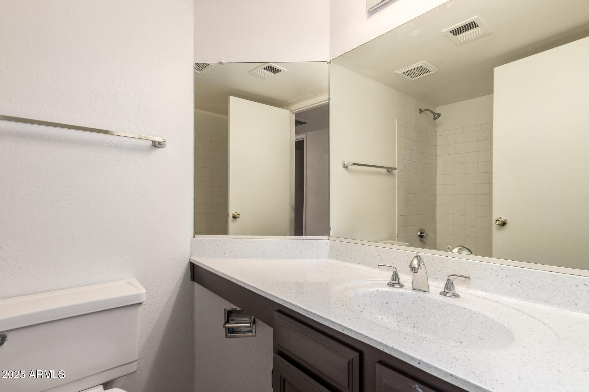 4346 East Sandia Street, Unit 5815 Phoenix, AZ 85044 - Photo 16 of 20 a bathroom with a sink and a mirror