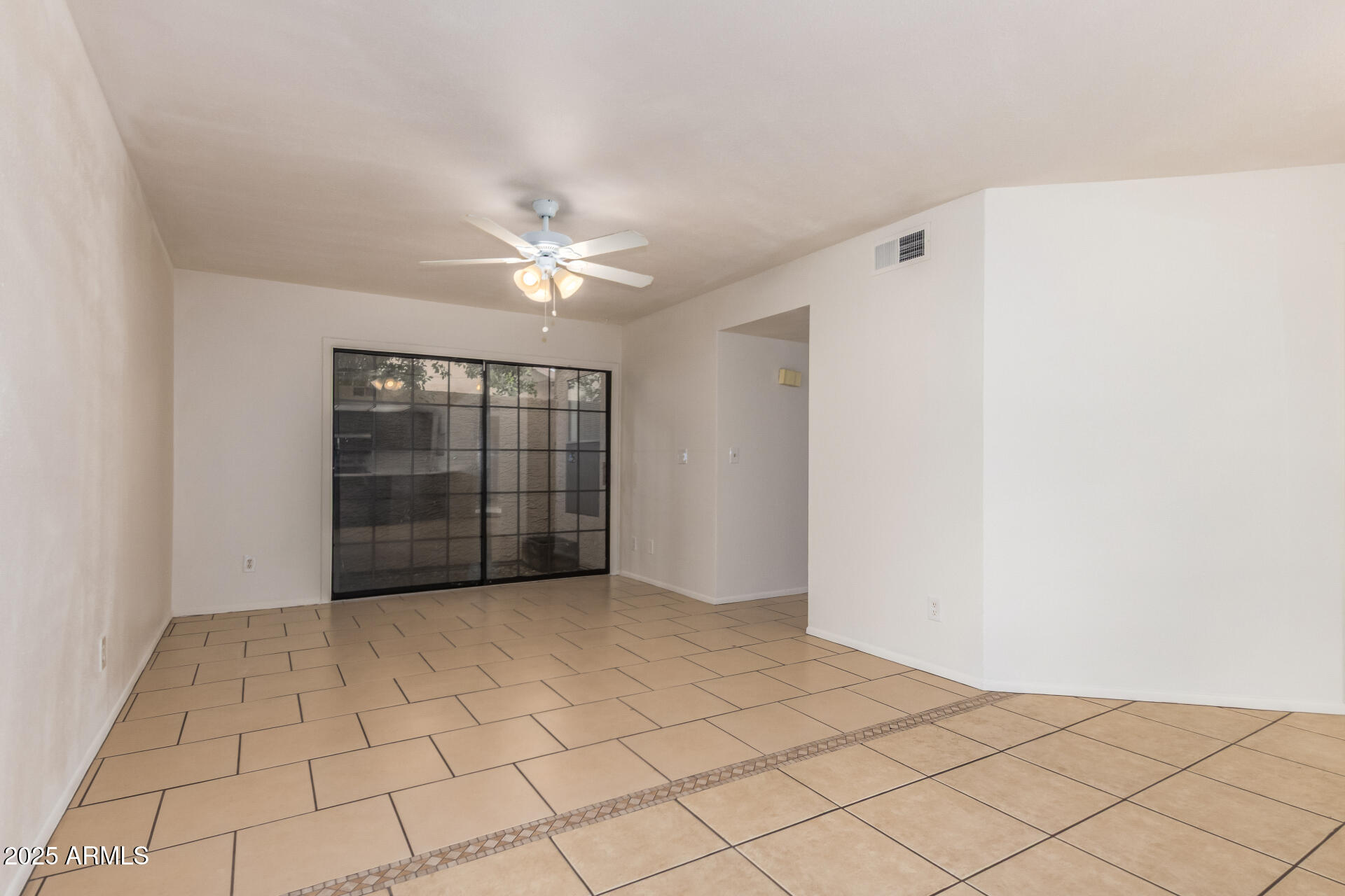 4346 East Sandia Street, Unit 5815 Phoenix, AZ 85044 - Photo 8 of 20 a view of an empty room with a window