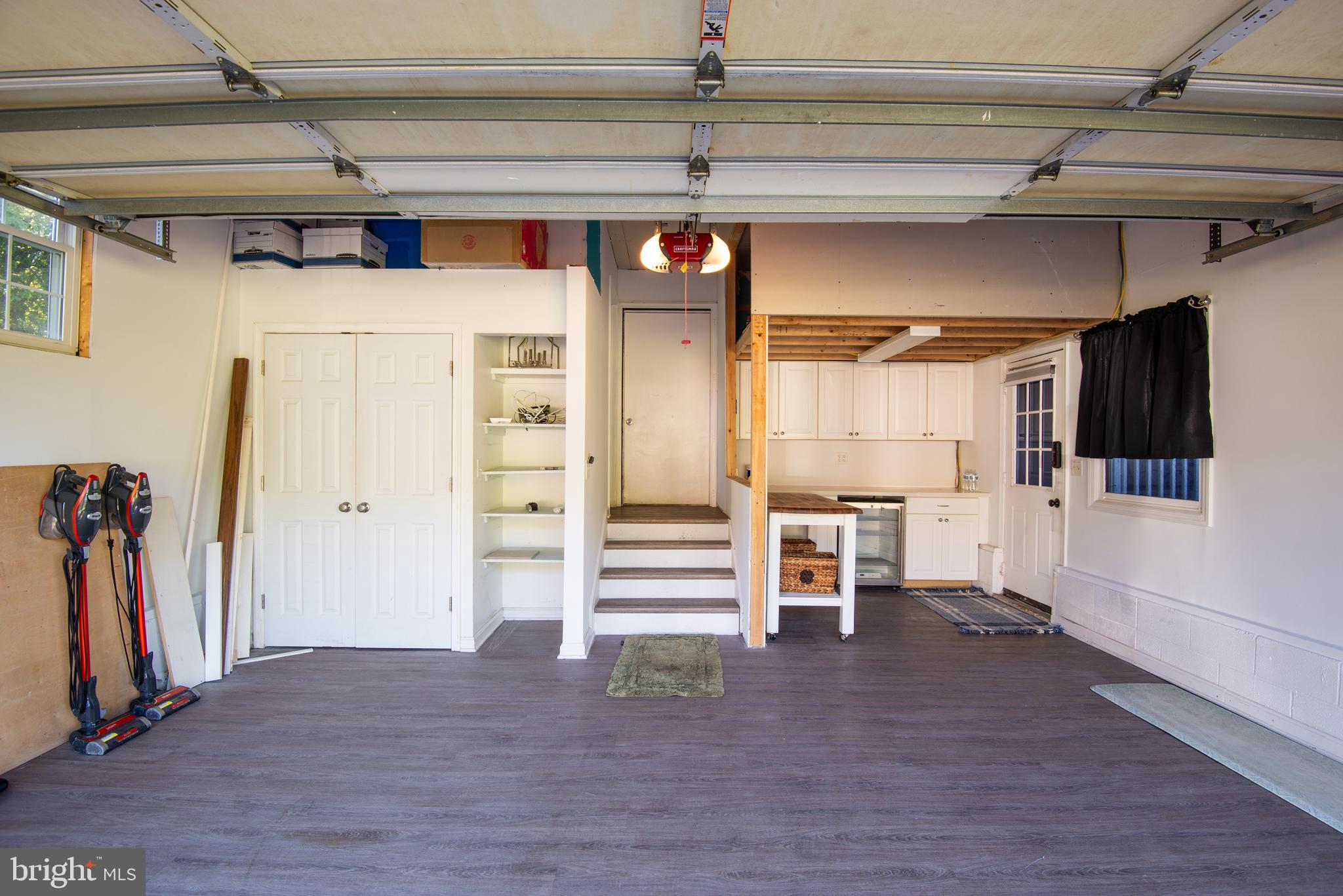 105 Barren Ridge Road Chester, MD 21619 - Photo 21 of 46 Garage, overhead storage, closet, cabinetry, frig