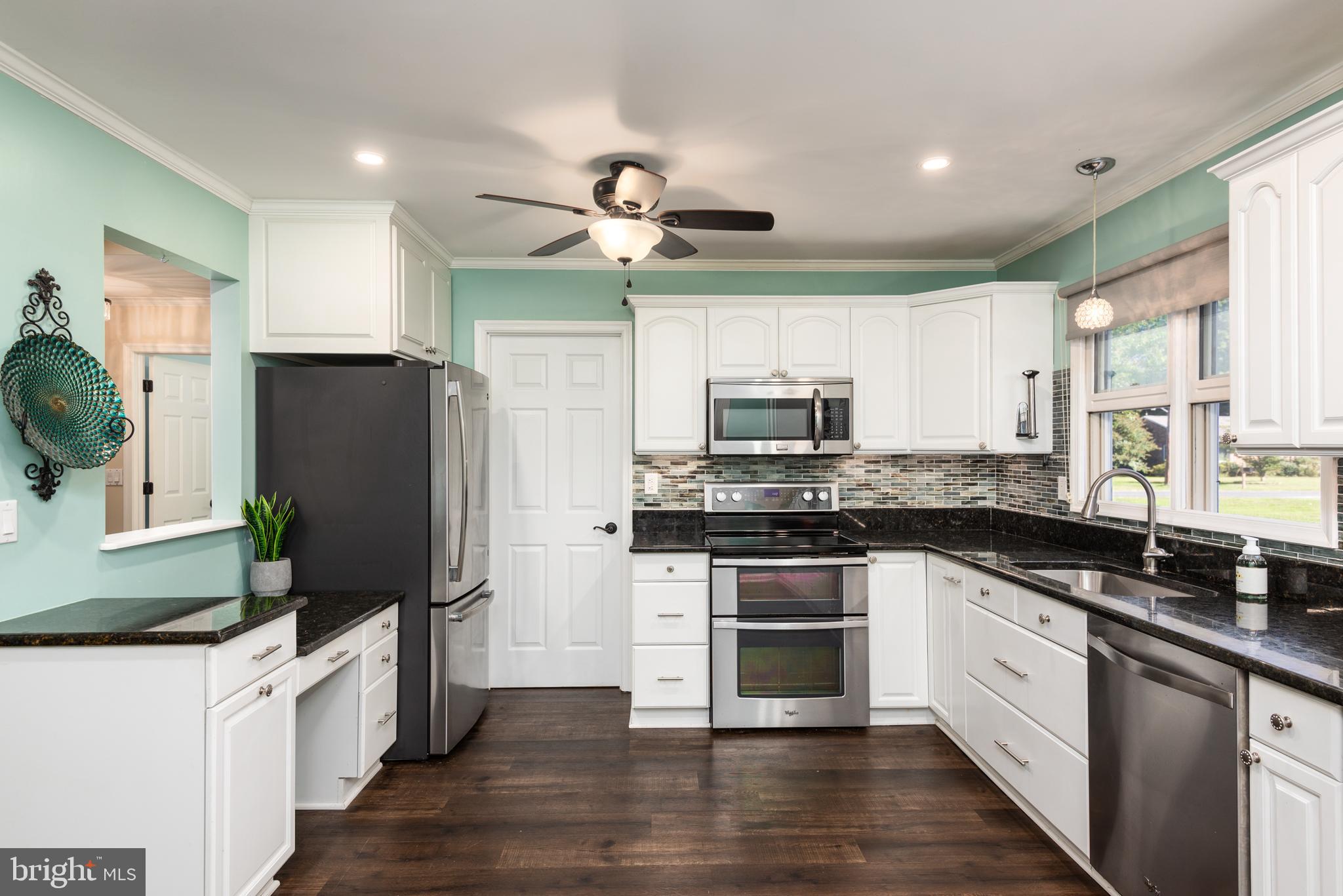 105 Barren Ridge Road Chester, MD 21619 - Photo 9 of 46 Custom cabinets & lighting, ss appli, granite