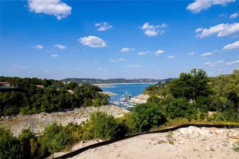 a view of a water pond with lots of green space