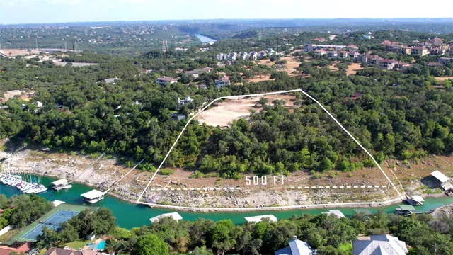 an aerial view of residential building with outdoor space and river