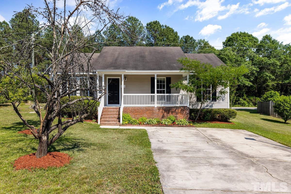 4516 Eider Court Raleigh, NC 27616 - Photo 1 of 28 a view of a house with a yard and potted plants
