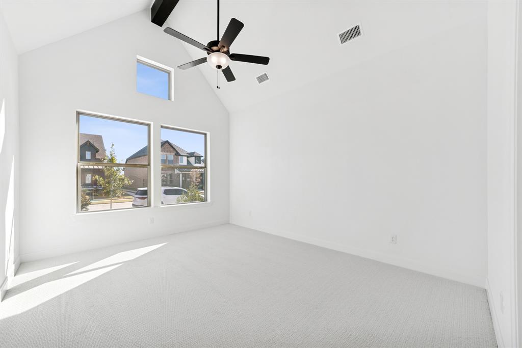 1842 Cole Road Van Alstyne, TX 75495 - Photo 8 of 35 an empty room with a window and a ceiling fan