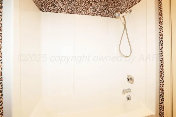 a bathroom with a sink vanity mirror and toilet