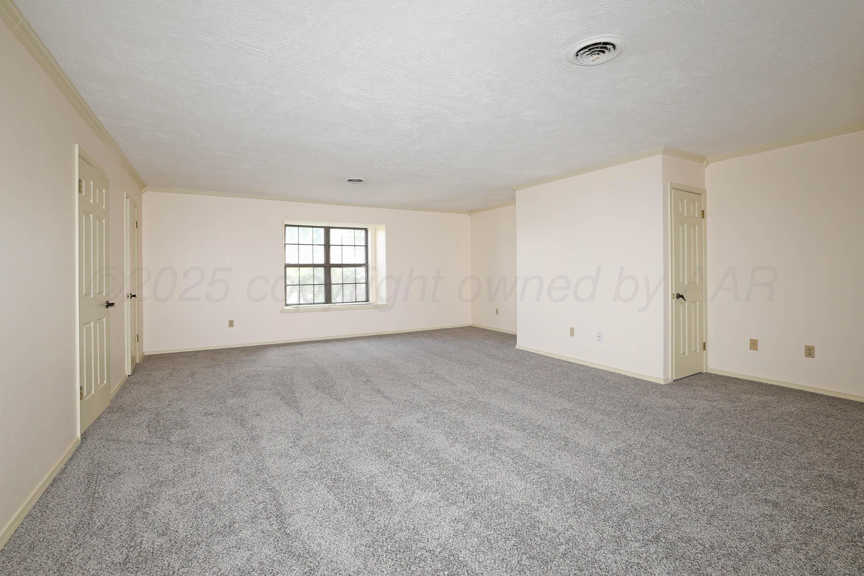 1615 South Bryan Street, Unit 19 Amarillo, TX 79102 - Photo 34 of 53 an empty room with windows