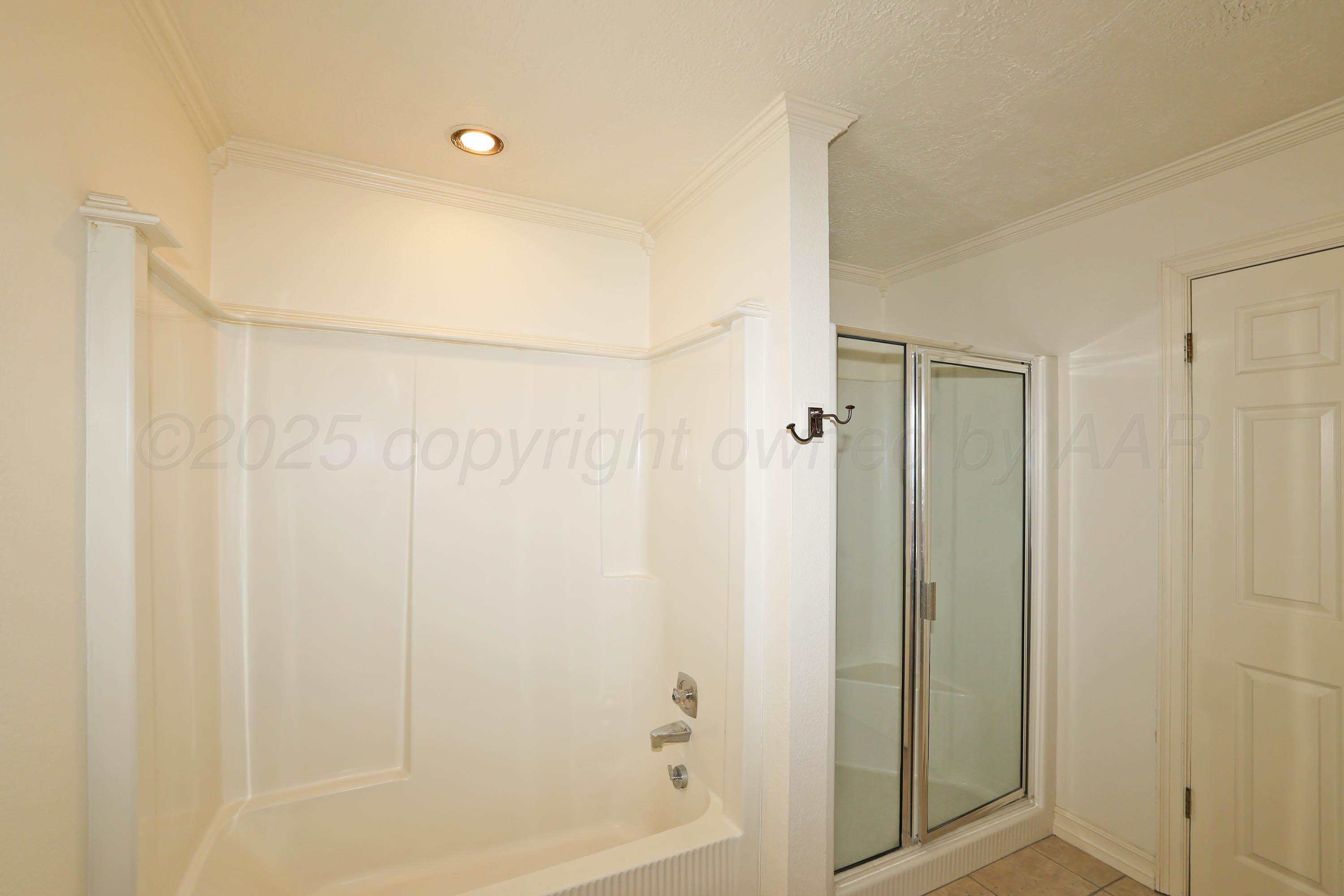 1615 South Bryan Street, Unit 19 Amarillo, TX 79102 - Photo 38 of 53 a bathroom with a shower and a tub