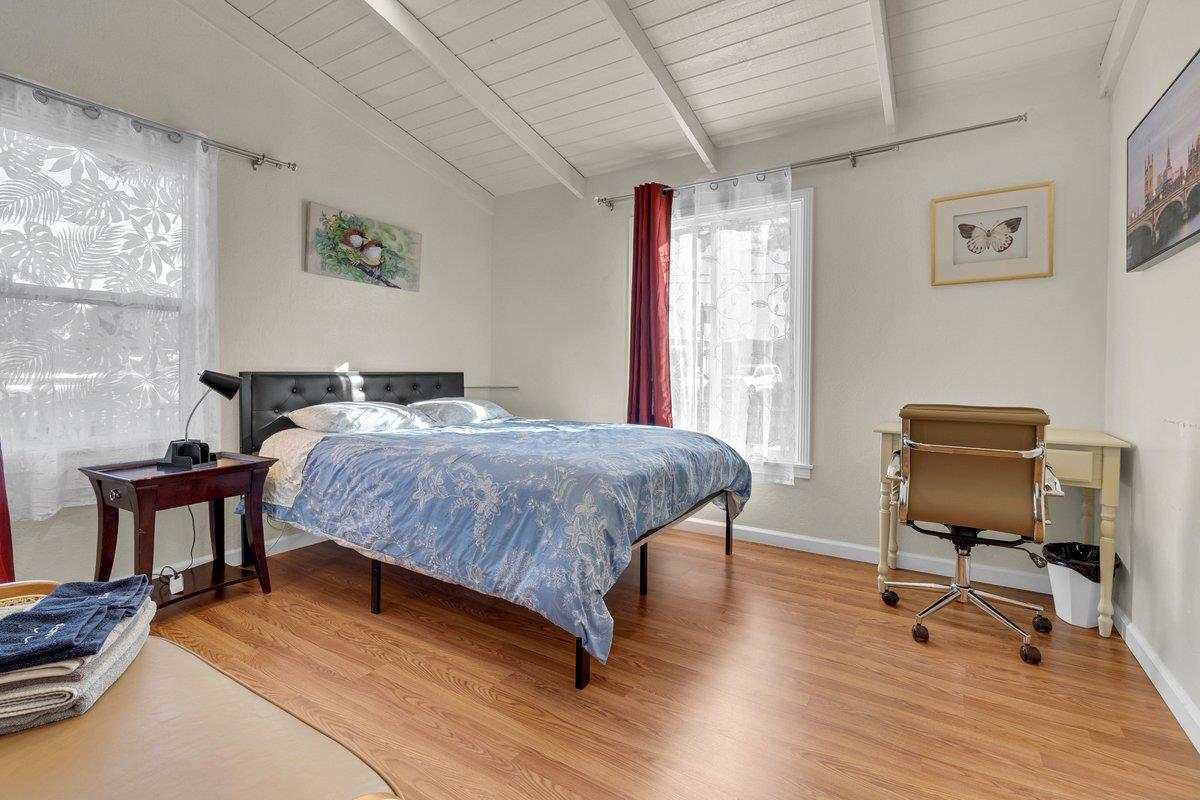 965 Portola Drive Del Rey Oaks, CA 93940 - Photo 14 of 23 a bedroom with a bed a table and chair